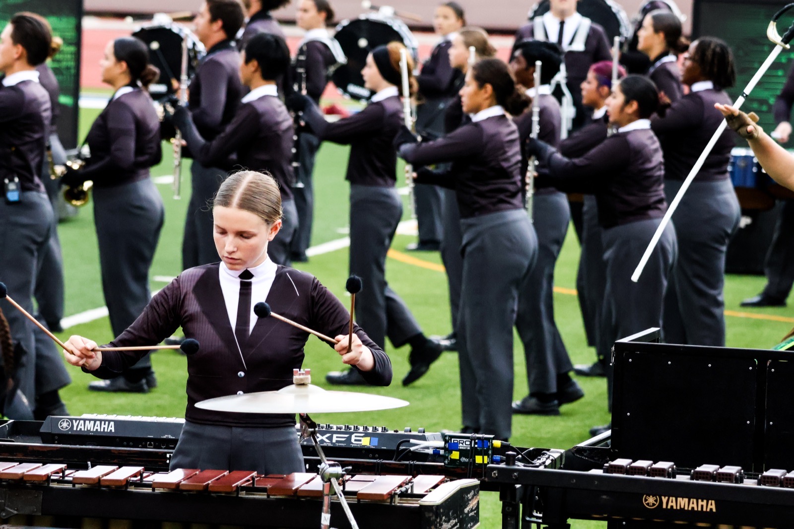 Little Elm marching band percussionist performing on the field